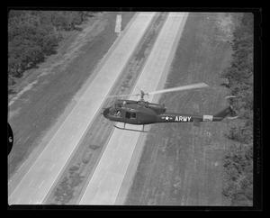 Primary view of object titled '[The YH-40 #7 flying over a freeway in Hurst, Texas]'.