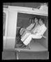 Primary view of [Service men seated in the cabin of the YH-40]