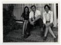 Photograph: [Three persons sitting together on steps]