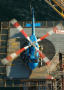 Photograph: [A blue helicopter on a helipad]