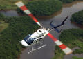 Photograph: [Flying helicopter over a river of water]