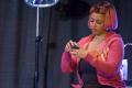 Photograph: [Kim Fields in a Pink Wig On-Stage]