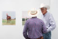 Photograph: [Two Cowboys at Photography Exhibit]