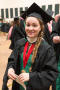 Photograph: [Graduate student poses in cap and gown]