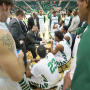 Photograph: [UNT Basketball Teammates Discuss Plays with Coach Tony Benford]