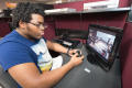 Photograph: [Student playing a computer game]
