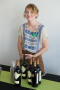 Photograph: [Bartender with Bottles of Wine at Art Reception]