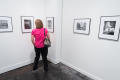 Photograph: [Woman in Pink at Exhibit]