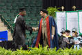 Photograph: [Male Graduate Student Shaking Hands with Dean]