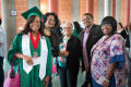 Photograph: [Undergraduate student and her family at commencement]