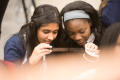 Photograph: [Westlake Academy Charter School students look at microfilm]