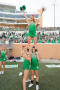 Photograph: [Cheerleader performs basic extension at Homecoming game]