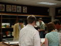 Photograph: [Induction attendees look at displays]