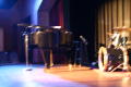 Photograph: [Piano and drums on stage]