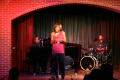 Photograph: [Rachel Webb singing on stage]