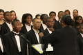 Photograph: [Choir looks toward the conductor]