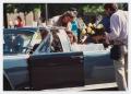 Primary view of [Actors and film crew prepare for motorcade scene in "JFK"]