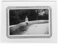 Photograph: [Unidentified Woman Sitting on a Wall]