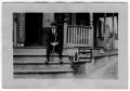 Photograph: [Unidentified Man Sitting on Porch]