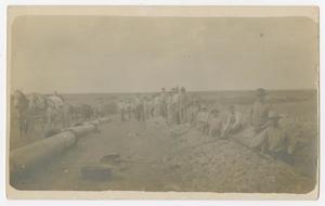 Primary view of object titled '[Men Padding a Ditch]'.