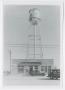 Photograph: [Building Below a Water Tower]