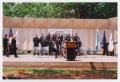 Primary view of [Police Chief Mike Jez, Mayor Euline Brock, and Officers on Stage at Law Enforcement Memorial Commission]