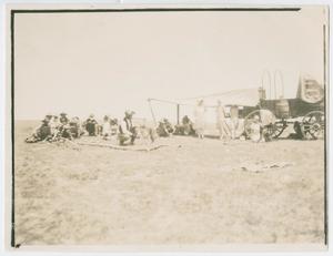 Primary view of object titled '[Men and Women by Chuckwagon]'.