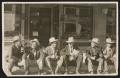 Photograph: [Cattlemen on Curb in Carlsbad]