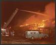 Photograph: [Dallas firemen hose down destructive fire]