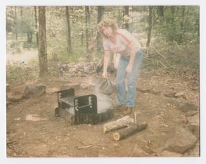 Primary view of object titled '[Woman Dousing a Campfire]'.
