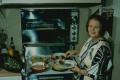 Photograph: [Photograph of Helen Corbitt cooking]