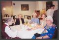 Photograph: [Charlyne Creger and Four Women at Table]