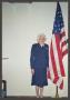 Photograph: [Charlyne Creger with U.S. Flag]