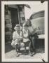Photograph: [Woman and Children by Car]