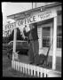 Photograph: Guyler Hamblen retiring the Post Office Sign in Fostoria, Texas