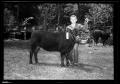 Photograph: [Boy With a Cow, Cleveland Dairy Days]