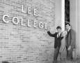 Photograph: [Three Students with Lee College Sign]
