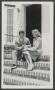 Photograph: [Man and Woman Sitting on Steps]