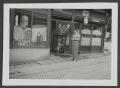 Thumbnail image of item number 1 in: '[Marjorie Wakeham Outside a Storefront]'.