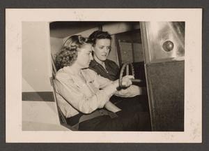 Primary view of object titled '[2 Women in Plane Cockpit]'.