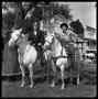 Photograph: [Bill Daniels and Hank Williams Jr. Riding Horses]