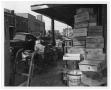 Photograph: [Sidewalk Crowded with Crates]