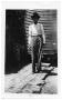 Primary view of [Portrait of a man standing on a brick walkway]