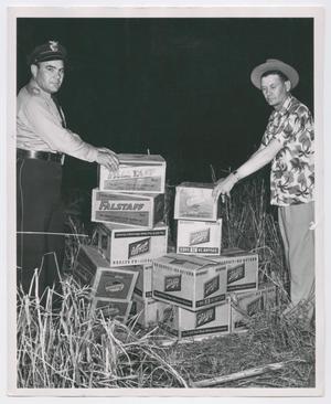 Primary view of object titled '[Officers Buck Luttrell and Leon Bowman Seizing Bootleg Beer]'.
