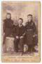 Photograph: [Two Young Girls and One Boy in Dark Clothing]