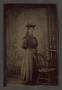 Primary view of [Sixteen-Year-Old Maude Kitchens Standing Next to a Chair]