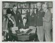 Photograph: [Thomas E. Keys Signing a Book]