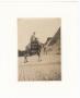 Photograph: [Photograph of Rev. Charles T. Caldwell Riding Camel]