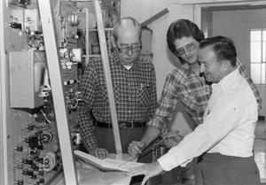 Primary view of object titled '[Air conditioning instructor Bennie Sparkman (right) with students Dave Clark and D.E. McDaniel.]'.