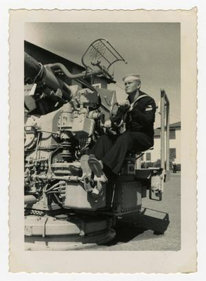 Primary view of object titled '[Arthur Howard Malone on a Vehicle]'.